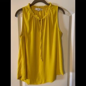 Cute sleeveless top with tie front.